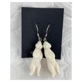 Pair of bone otter earrings on sterling silver hoo