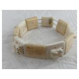 J. Omiak colored ivory and ancient ivory stretch b