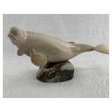 Adorable whale bone carving of a well fed beluga w