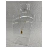 Solid gold nugget pendant with tiny diamond inset