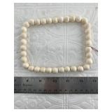 Small strand of mammoth ivory beads, threaded clas