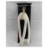 Abstract twisted walrus ivory carving suspended fr