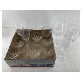Variety of clear glass drinking cups including Ara