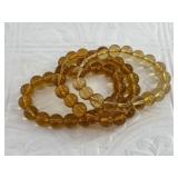 Lot with 3 polished amber bead stretch bracelets