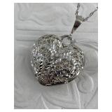 Sterling silver necklace with an ornate heart pend