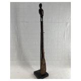 African hand carved paddle on a beautiful display