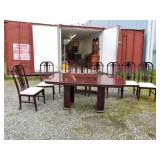 Dining table and chairs with a lustrous finish, wi