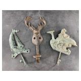 3 Cast iron coat hangers
