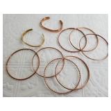 Several copper bangles