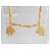 Vintage ivory necklace with small carved small bea