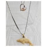 Sterling silver heart shaped necklace with a paw a
