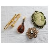 4 Vintage brooches, including 2 cameo brooches