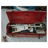 Vintage metal tool box filled with a variety of ro