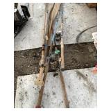 Variety of vintage fishing rods, reels, and oars N