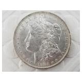 1884 O Morgan silver dollar   AU50 or better