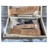 Box of tooled leather and leather working tools