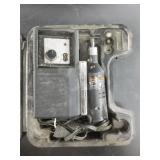 Black and Decker older model rotary tool with some