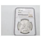 1887 Morgan silver dollar, MS63 by NGC