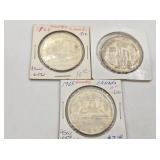 Three Canadian silver dollars: 1958, 1955, 1966