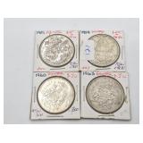 Four Canadian 50 cent silver coins: 1951, 1954, 19