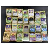 Lot of Sleeved Fossil 1st edition 1999 Pokemon Car