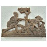 Wood carving of an African hunter on successful hu