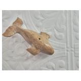 Old whalebone carving of a whale