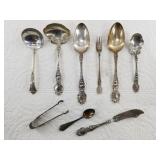 9 Pieces of silver flatware: 8 are sterling, 1 is