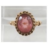 10kt gold ring with a scuffed center stone, size 5