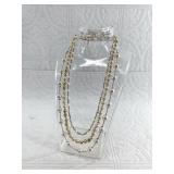 Strands of faux pearls