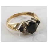 14kt gold ring with black center stone, size 6, to