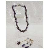 Lot of amethyst jewelry including a necklace, pin