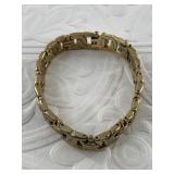 Gold tone bracelet with extra clasp