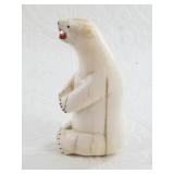 Vintage ivory carving of a seated snarling bear wi