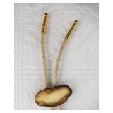 Bolo tie made with a polished piece of ancient wal