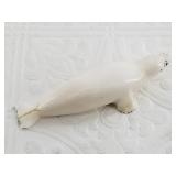 John Penatac ivory carving of a seal in graceful p