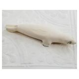 John Penatac ivory carving of a seal in graceful p