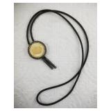 Silver-tone bolo bezel with an Alaskan Convention