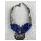 Silver toned statement necklace with several dozen