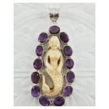 Sterling silver and amethyst pendant with a carved