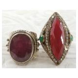 2 Sterling silver rings,  one has a ruby size 7, a