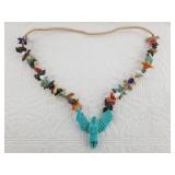 Statement necklace with dozens of stone carved ani