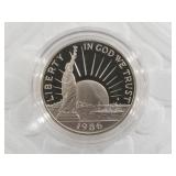 1986 S Nation of Immigrants clad half dollar in mi