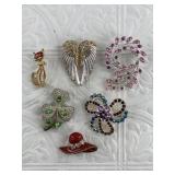Several fashion brooches