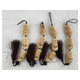 Carved bone miniatures on strings