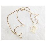 Bone carved turtle pendant on a woven cord