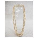14kt Gold and carved ivory necklace, each ivory be