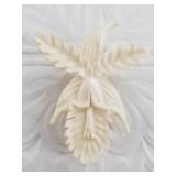 Antique ivory brooch carved into a locket in excel