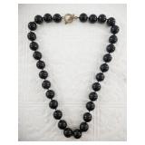 Hand tied bead necklace with a silver clasp