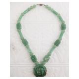 Jade necklace with a carved rose center and variet